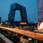 Beijing skyline at blue hour showing CCTV headquarters and modern tech district — Photo by Unsplash